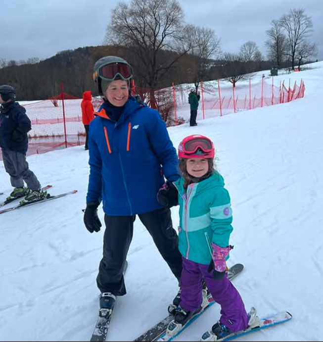 A Ski instructor and child during a private lesson