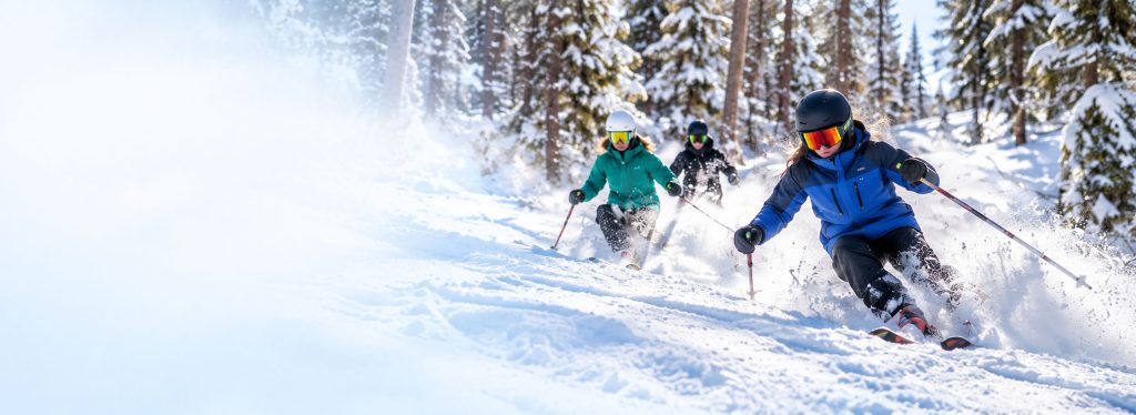 Skiers going downhill for the Free Riders Program